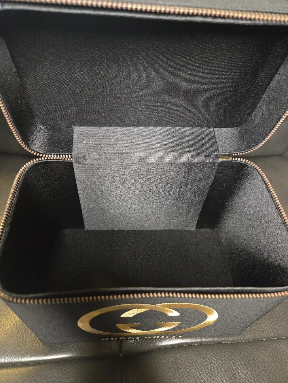 Gucci Black and Gold Travel Case